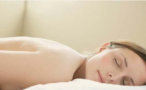 client receiving back massage treatment